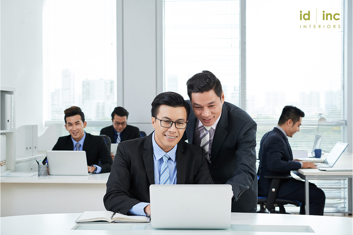 People moving around in an office-office design singapore